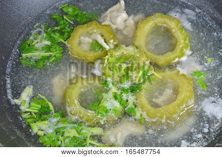 boiled bitter cucumber cooked in hot electric pot