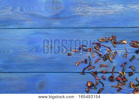 blue wooden texture background with dried pepper