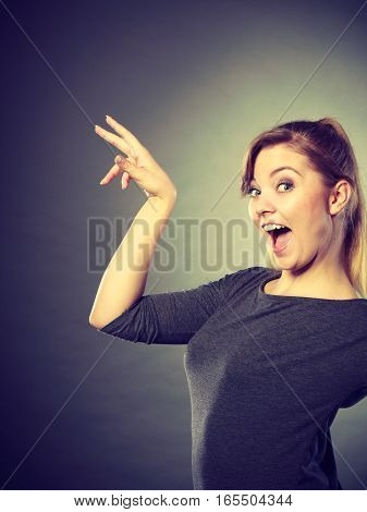 Leisure relax beauty concept. Cheerful girl fooling. Young laughing blond lady showing happiness expressing joy having fun.