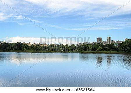 Lake Reflecting On The Water The City And The Blue Sky. Margins Of The Lake Igapo In Londrina, Pr, B