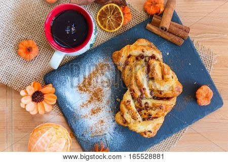 marple and pecan plait pastry sweet food breakfast with tea cup and flower
