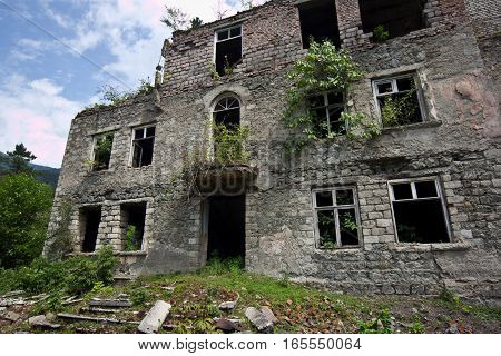Abandoned mining ghost-town Polyana, Abkhazia. Destroyed empty houses, remnant of The Georgian-Abkhazian war