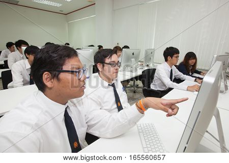Bangkok, Thailand - November 17, 2015 : 
King Mongkut's Institute of Technology Ladkrabang is a research and educational institution in Thailand.
A class of students in front of their screens study computer science.