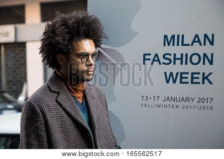 MILAN ITALY - JANUARY 15: Fashionable man poses outside Damir Doma fashion show building during Milan Men's Fashion Week on JANUARY 15 2017 in Milan.