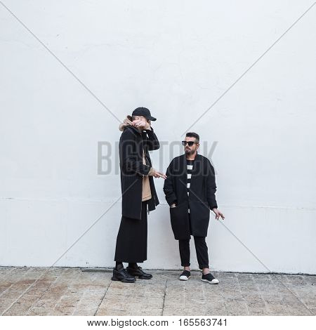MILAN ITALY - JANUARY 15: Fashionable people gather outside Damir Doma fashion show building during Milan Men's Fashion Week on JANUARY 15 2017 in Milan.