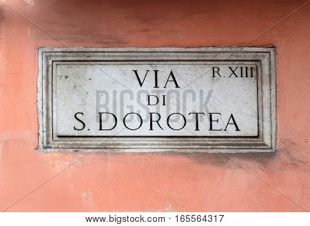 Via di S. Dorotea, street plate on a wall of old house in Trastevere district, Rome, Italy
