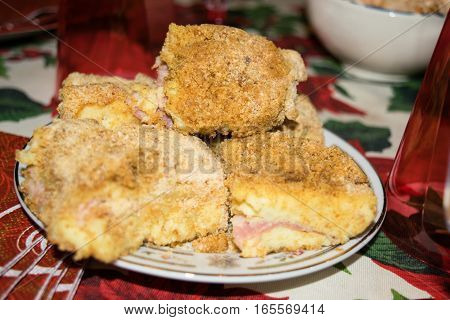 Potatoes gateau stuffed with ham and cheese