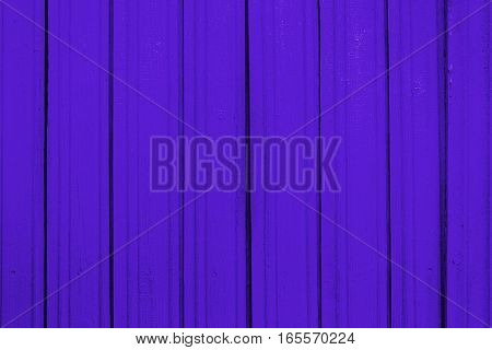 Texture of old wooden planks with peeling color paint