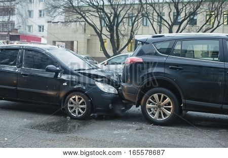 Car accident on the city road slippery