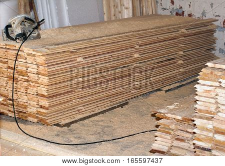 Stack of new wooden studs at the lumber yard, wall paneling