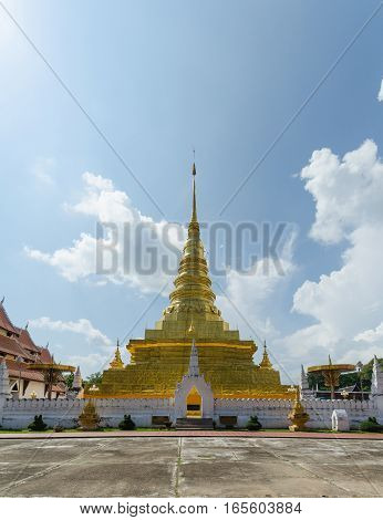 Golden pagoda and blue sky in Phra That Chae Haeng temple nan province thailand