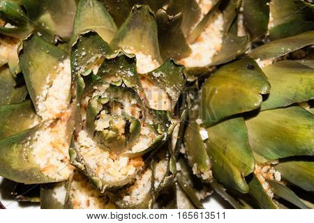 Artichokes topped with breadcrumbs and cheese and steamed