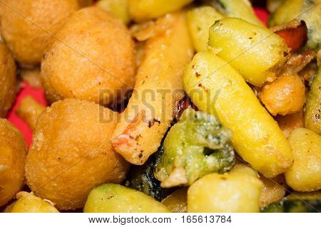 Mix of fried vegetables, potatoes and mozzarella cheese