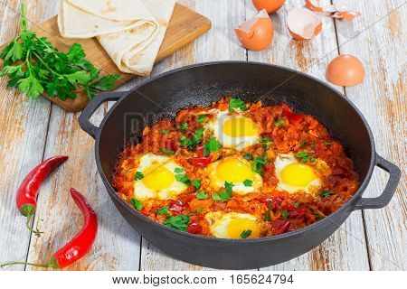 Basic Shakshuka  In Cast Iron Pan With Ingredients