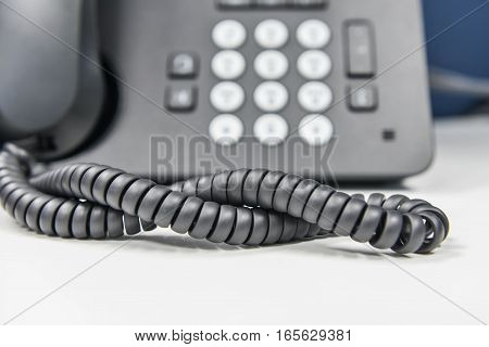 Spiral line of IP Phone on the white table