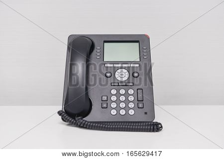 Black IP Phone on the white screen