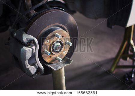 Car brake disc without wheels closeup with repair.