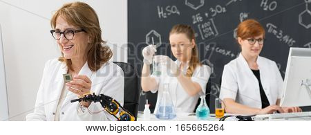 Smiling Chemistry Teacher With Students