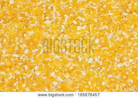 Raw dried cornmeal mush background. Cornmeal macro