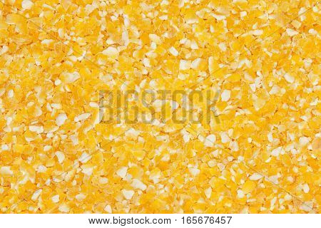 Raw dried cornmeal mush background. Cornmeal macro