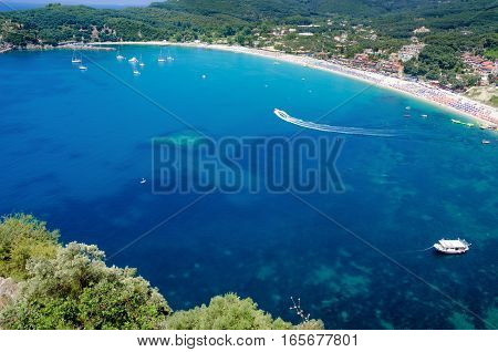 Beautiful aerial view of blue water bay with boats near Valtos beach Greece