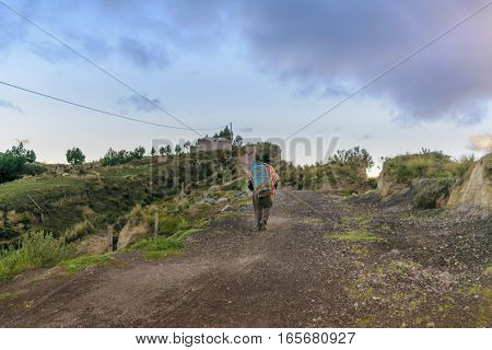 Andean Native Walking At Road Quilotoa Ecuador