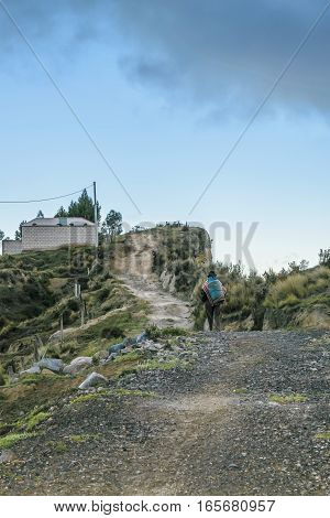 Andean Native Walking At Road Quilotoa Ecuador