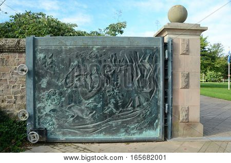 A view of a bronze gate at a memorial garden in Perth