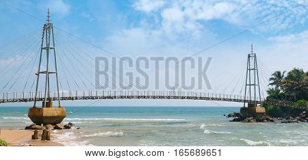Bridge to the island with a Buddhist temple Matara Sri Lanka