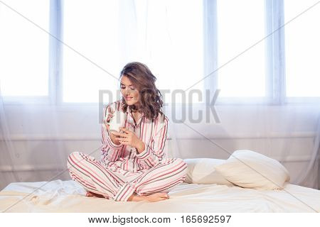 girl pyjamas bed morning cup of coffee