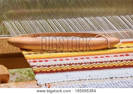 Wooden Shuttle with Bobbin on the Weft Yarn