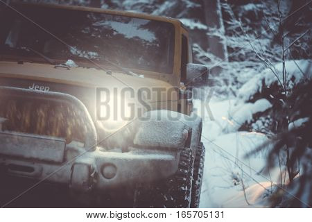 Karelian isthmus, Leningrad region, Russia - January 15, 2017. Jeep Wrangler unlimited on a forest road, the Wrangler is a compact SUV produced by Chrysler