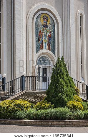 Church Dmitry Rostovsky - Orthodox church in Rostov -on-Don Russia . A bright day in May the sun glare on the gilded dome . The central entrance .