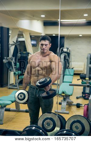 At the sports Hall. Man training. Sports. Hard Work Gym