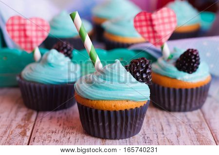 Vanilla cupcakes with mint cream decorated for Valentine's day