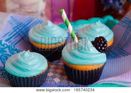 Vanilla cupcakes with mint cream decorated for the holiday