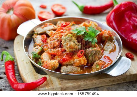 Traditional hungarian paprikash - chicken pork or beef goulash stew with paprika tomatoes garlic chilli and sour cream