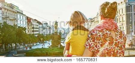 Mother And Daughter Tourists Exploring Attractions In Prague