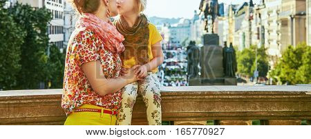 Smiling Mother And Daughter Tourists In Prague Kissing