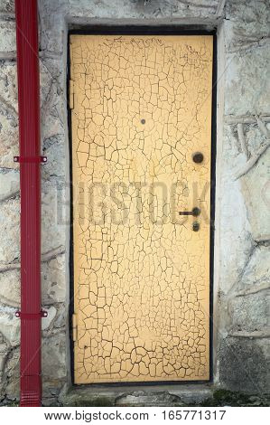 Old yellow rusty gate in the mediterrian style house as a background. Front view. Have a place for text.