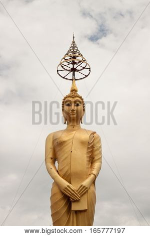 Golden big buddha statue in thai temple