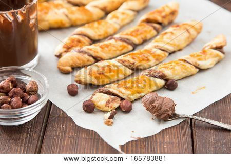 Homemade Cakes - Puff Pastry With Chocolate Paste. Twisted Cakes With Chocolate