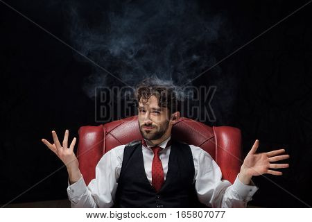 Concept of stress with businessman and smoke in head. Close up
