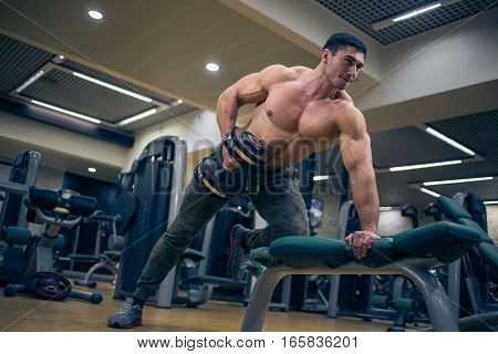 At the sports Hall. Man training. Sports. Hard Work Gym