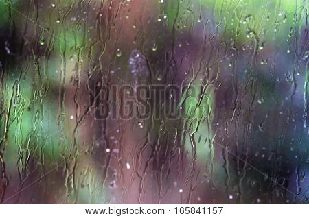 Water running down the glass - abstract background
