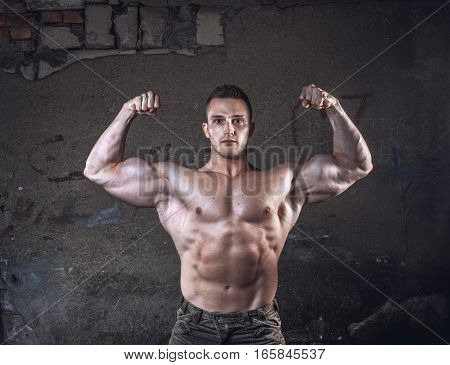 Bodybuilder On Grunge Wall