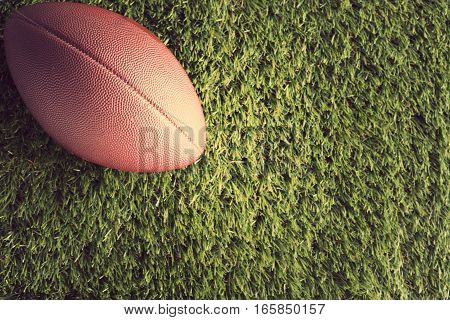 Vintage football over grass seen from above