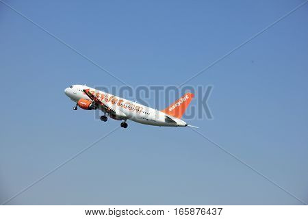 Amsterdam The Netherlands - June 12 2015: G-EZTI easyJet Airbus A320-214 takes off at Amsterdam Airport Schiphol Polderbaan runway. EasyJet is a British low-cost airline carrier based at London Luton Airport