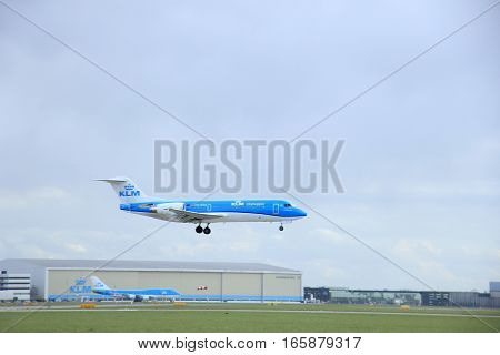Schiphol Amsterdam The Netherlands March 31 2015: Ph-kzu Klm Cityhopper Fokker F70 Approaching On Ru