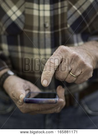 Man pointing to iPhone face on ready to enter vertical